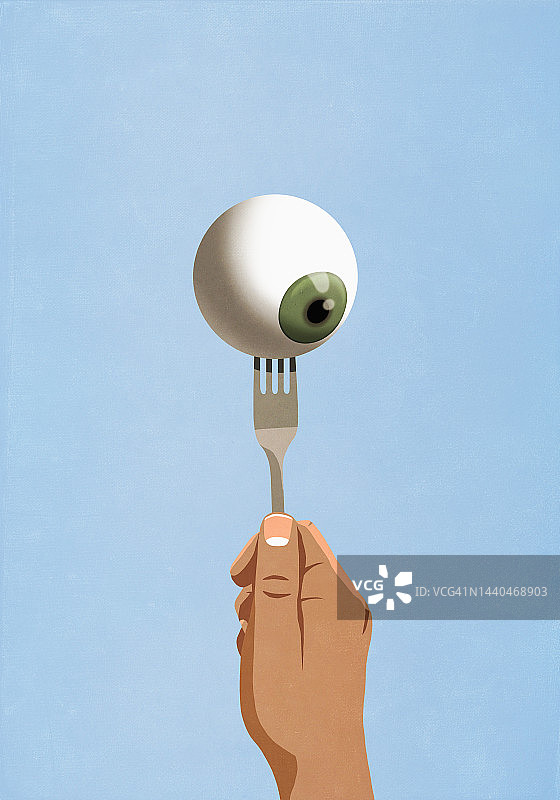 手持带眼球的叉子图片素材