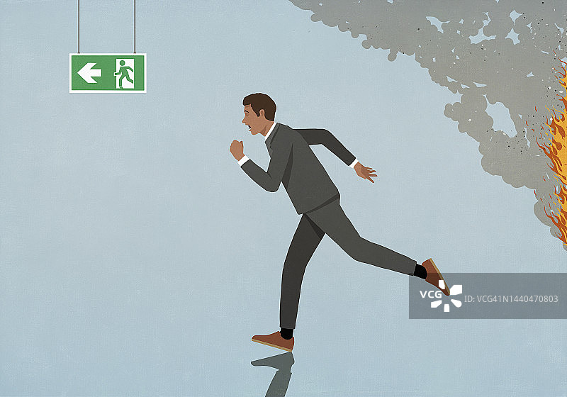 商人逃离火灾，奔向出口标志图片素材