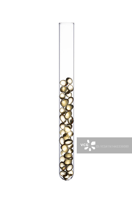 试管中金色的软胶囊图片素材