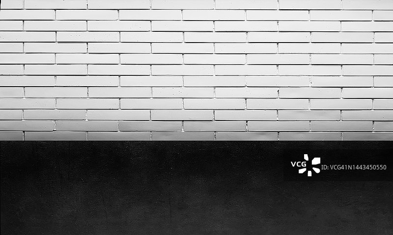 黑色水泥地面，白色砖墙背景图片素材