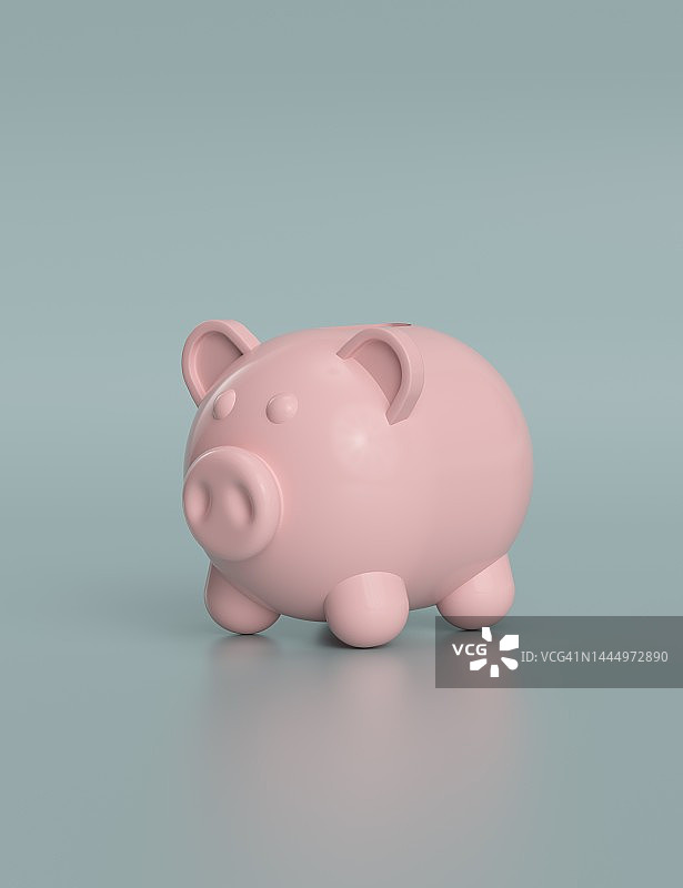 金币落入粉色小猪储蓄罐图片素材