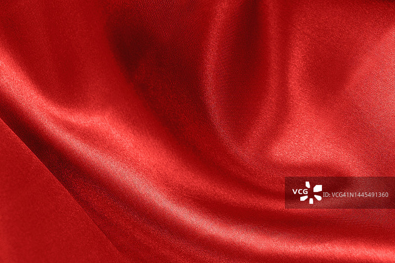 珊瑚色缎面波浪纹理背景，红色布料奢华产品展示图片素材