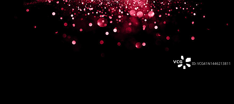 黑色背景上美丽的模糊品红色背景图片素材