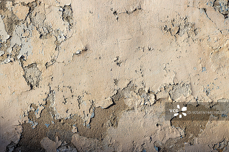 米色旧墙面与剥落的油漆纹理背景图片素材