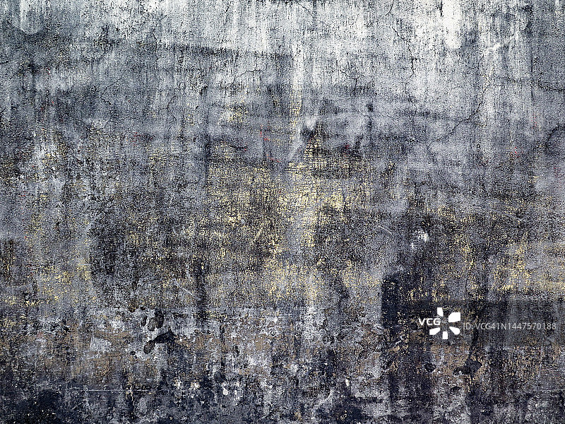 瓜德罗普岛：混凝土墙上白色、灰色和黄色的风化刮痕油漆图片素材