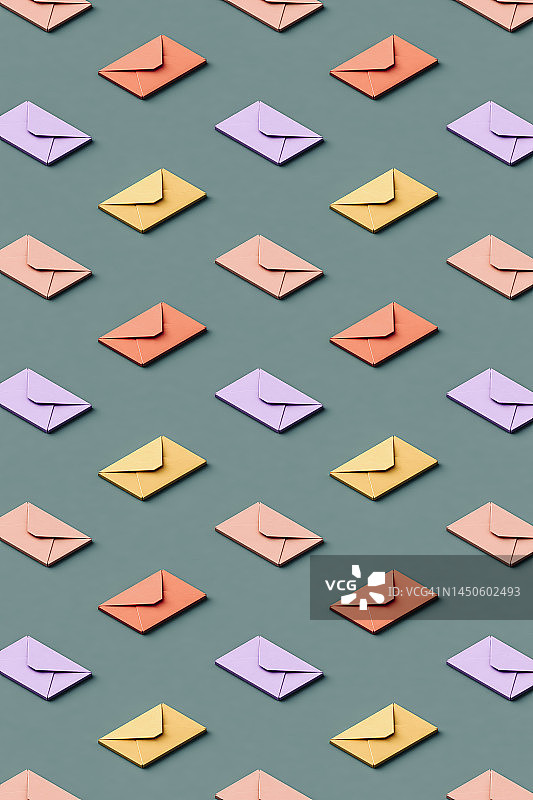 粉彩色信封的3D图案，平铺在绿色背景上图片素材