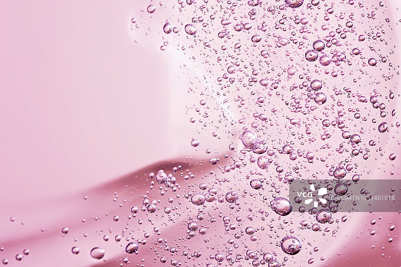 粉色背景芦荟胶化妆品宏观质地特写图片素材