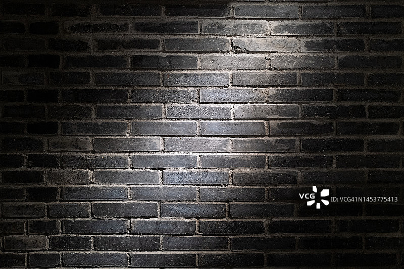 黑色砖墙上的光效图片素材