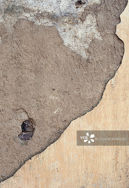 浅黄色油漆剥落的混凝土外墙图片素材