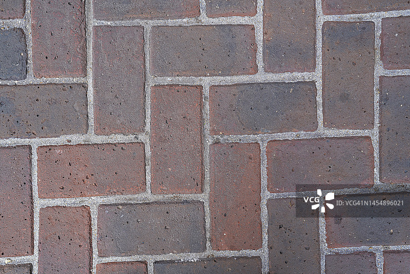 深橙色矩形砖面，图案排列，高角度聚焦图片素材