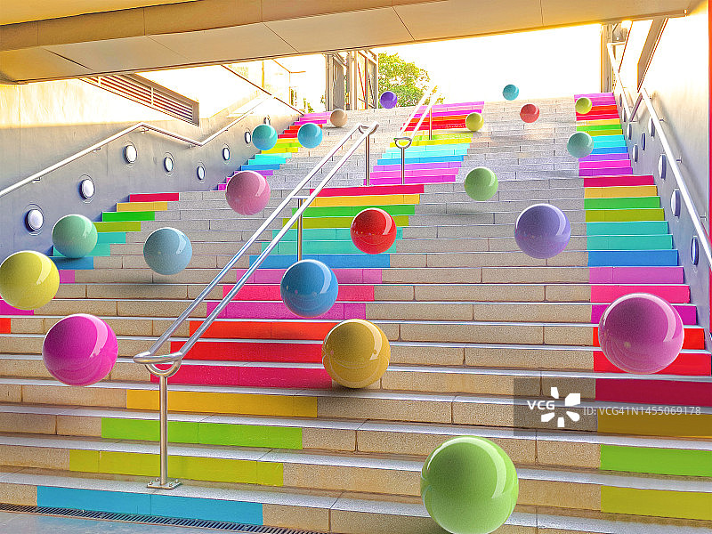 城市阶梯上彩色球体的彩虹色数字图像图片素材