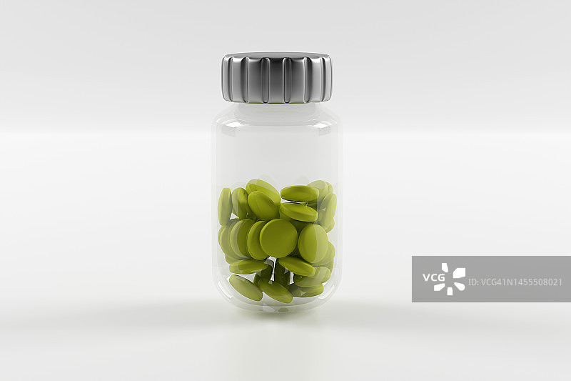 白色背景上装满绿色药丸的塑料瓶图片素材