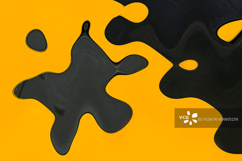 抽象黑色和橙色液体形状融合图片素材