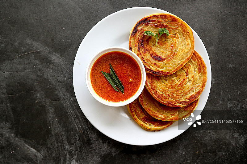 印度抛饼，受欢迎的早餐菜肴，罗马尼亚图片素材