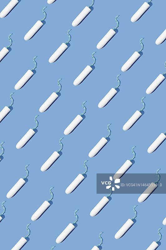 蓝色背景重复卫生棉条图案图片素材