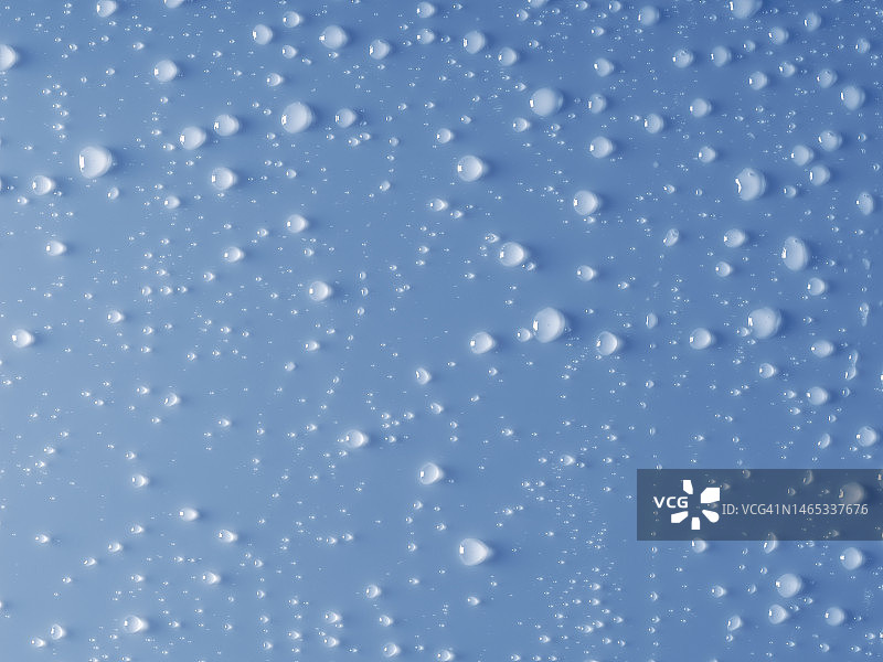 蓝色背景上的雨滴滑落图片素材