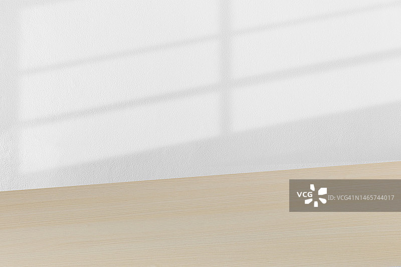 白色混凝土墙上桌面的阴影图片素材