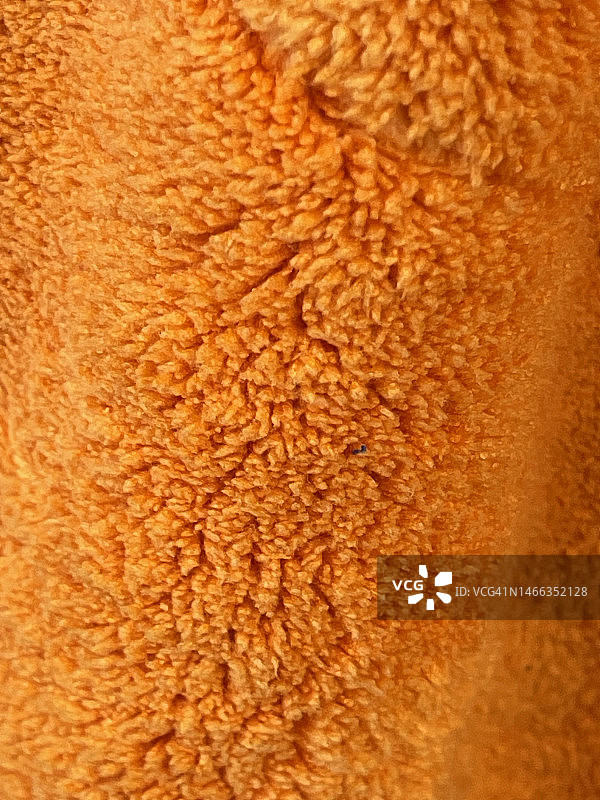 橙色超细纤维毛巾特写图片素材