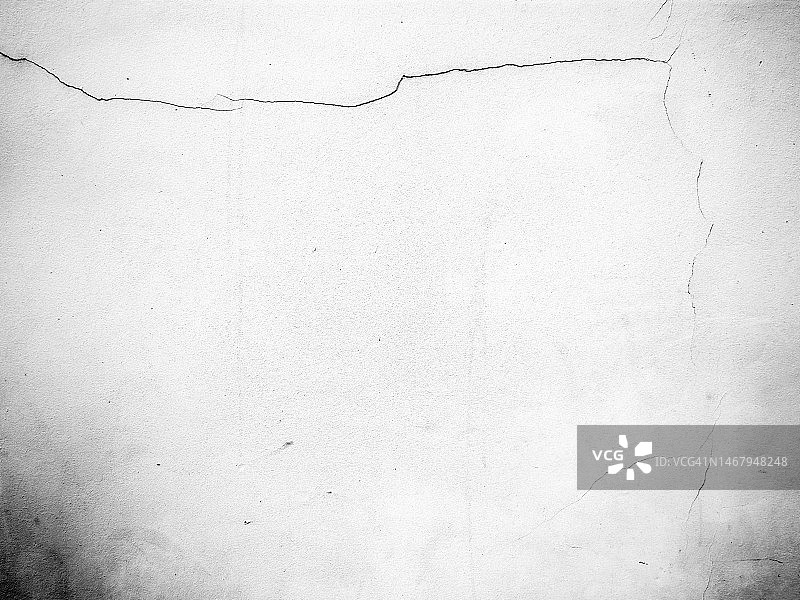 黑白照片：布鲁塞尔的白色裂纹混凝土墙与阴影图片素材