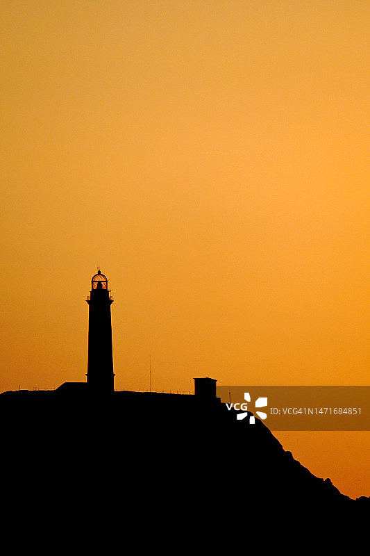 西班牙加利西亚维拉诺角灯塔日落图片素材