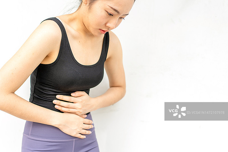 患有胃痛、月经期痉挛、腹痛和食物中毒的妇女图片素材