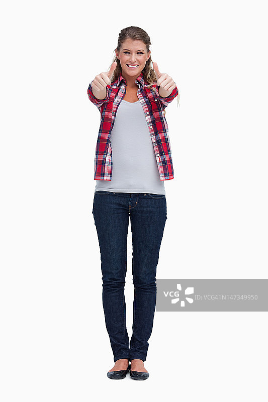 竖起大拇指的女人肖像图片素材