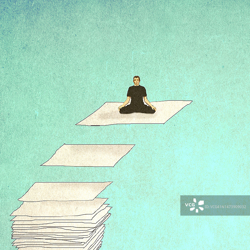 男人在漂浮的纸上冥想图片素材