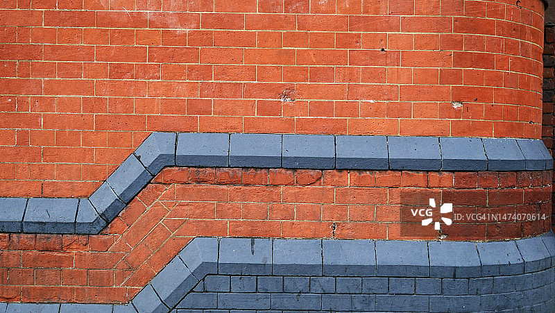 英国伦敦维多利亚建筑的蓝色风化砖石墙图片素材