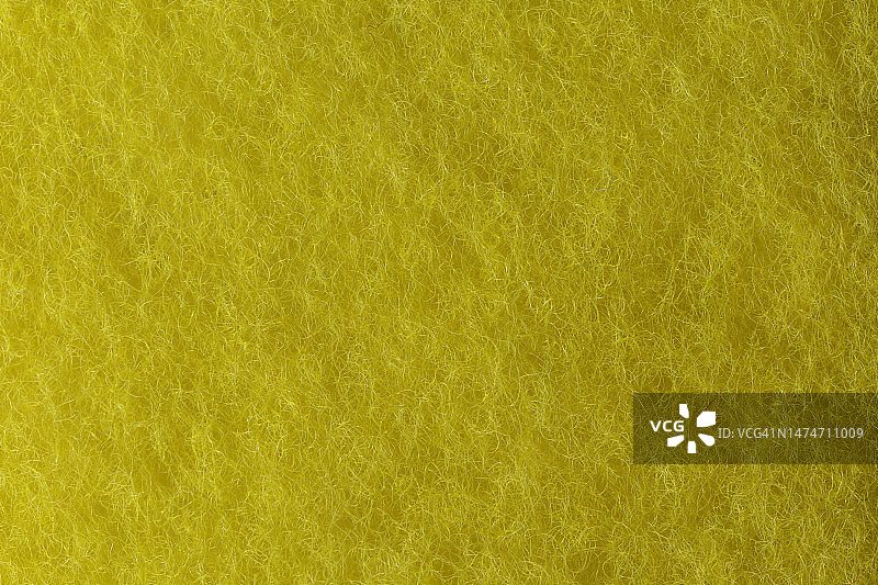 用于洗碗的黄色海绵细节，纹理背景图片素材