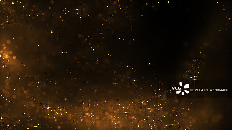 黑色背景上的金色粒子和闪光，带文案空间图片素材