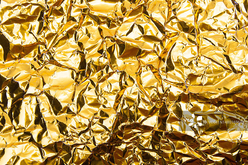 金色褶皱箔纸纹理背景，罗马尼亚图片素材