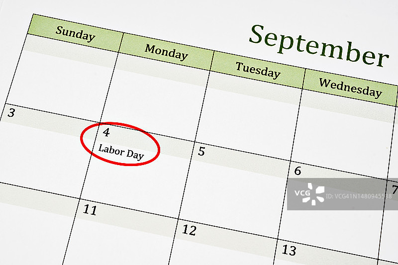 提醒重要事件，日历上用红色标记的九月劳动节图片素材