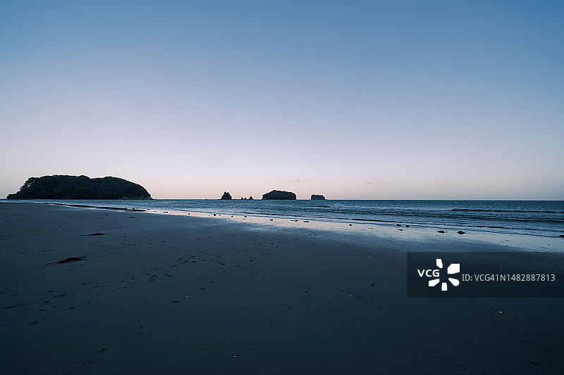 新西兰旺格马塔海滩的日出，海岸日出，风景摄影图片素材