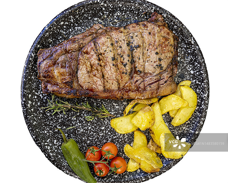 烤牛排配土豆和番茄图片素材