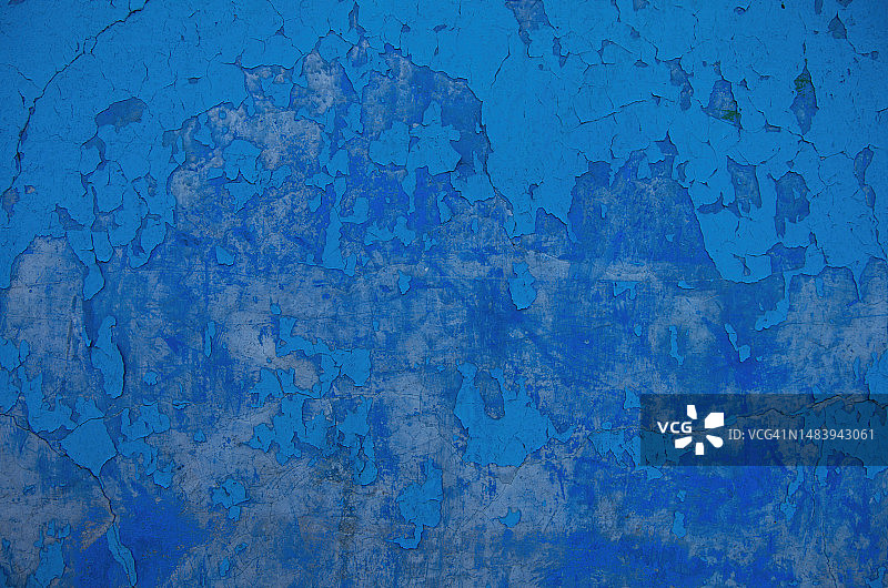 蓝色油漆剥落的灰泥墙图片素材
