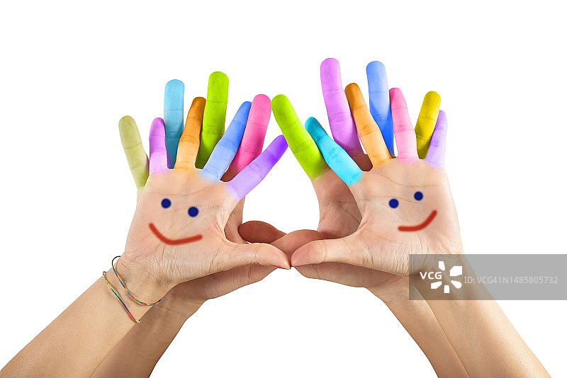 在白色背景下拿着彩色颜料的双手图片素材