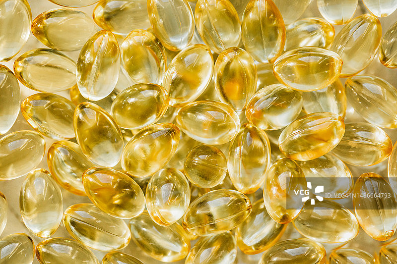 药丸或胶囊的背景特写，营养补充剂，每日维生素图片素材