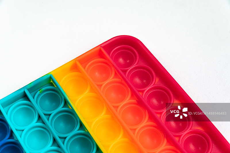 彩虹色指尖泡泡玩具，抗压益智图片素材