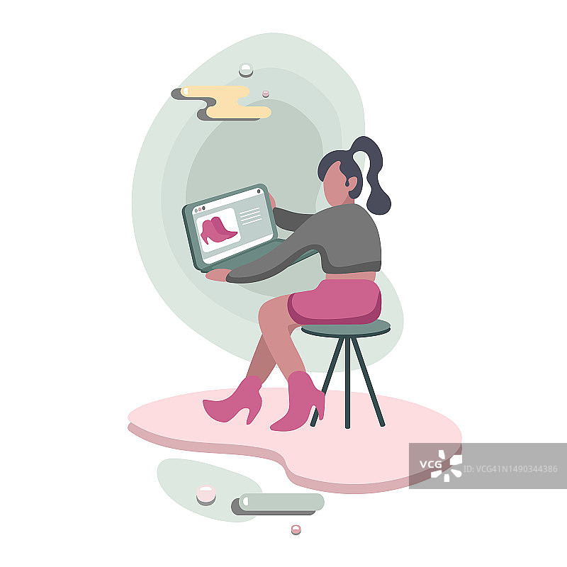 漂亮的女人拿着平板电脑在线购物买鞋图片素材