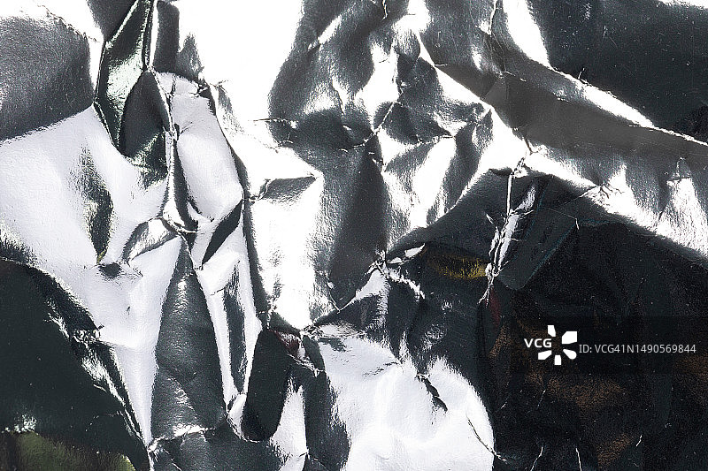 有光泽的皱纸纹理背景特写图片素材