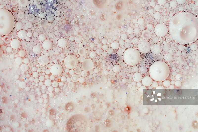 油，金色的颜料，牛奶和水。美丽的自然纹理背景。图片素材