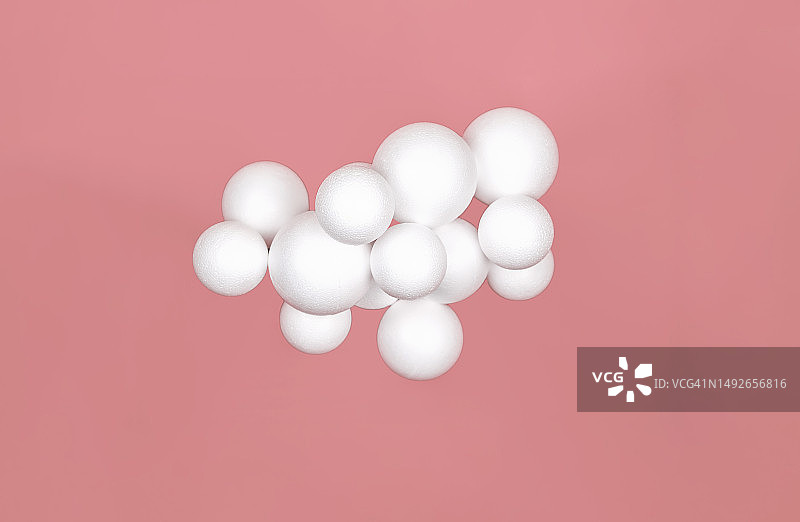 红色背景上的一组白色球体，云概念、虚拟现实或科学实验图片素材