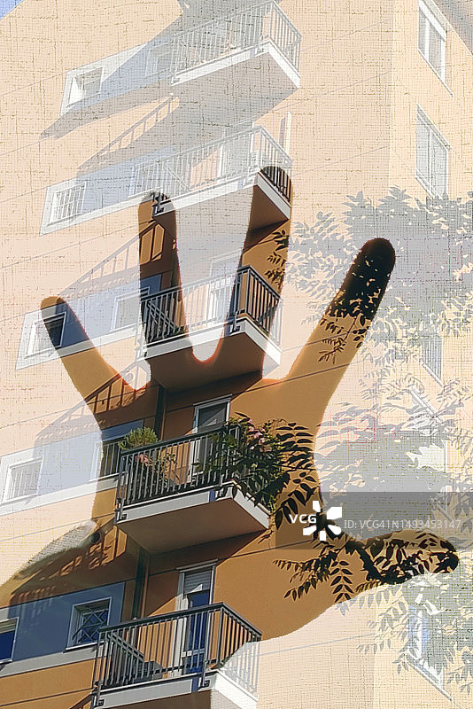张开的手的轮廓，公寓外墙背景图片素材