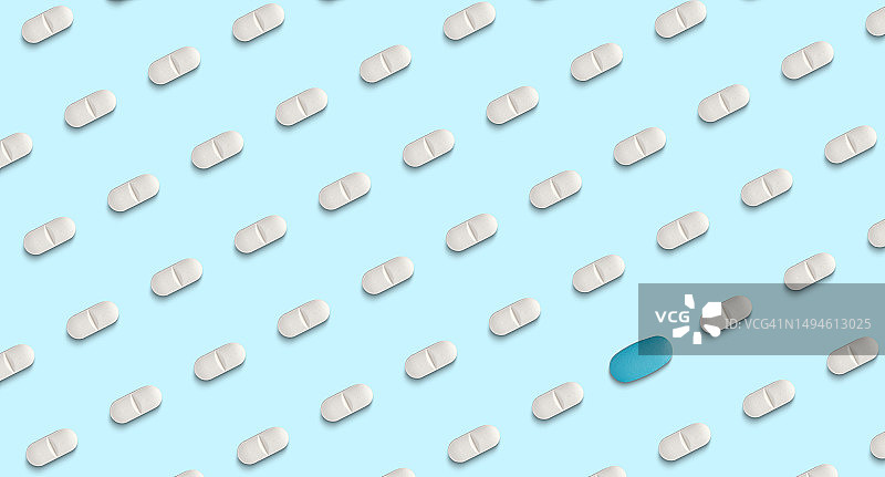 浅蓝色背景上的药丸图案图片素材
