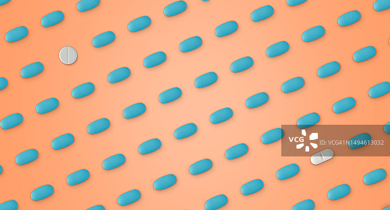 淡橙色背景上的药丸图案图片素材