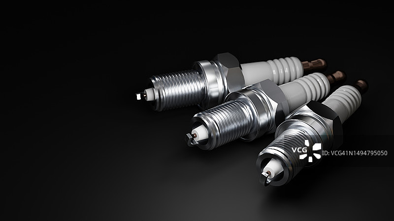 黑色背景上的火花塞图片素材