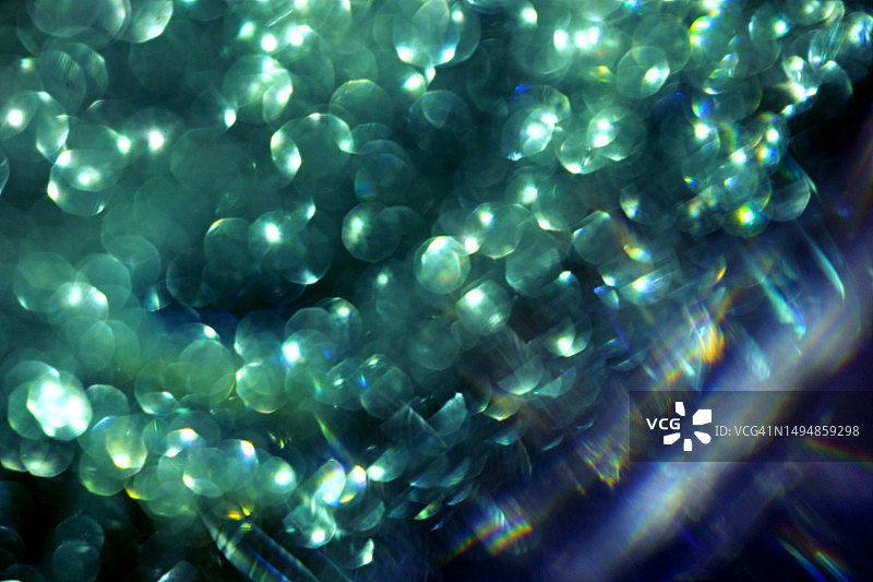 抽象闪光绿色散景光背景，圣诞新年奢华图案宏图片素材