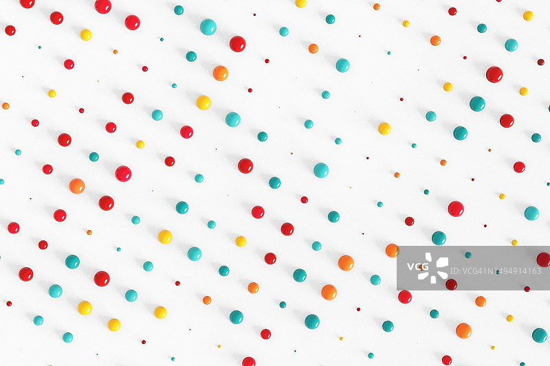 白色点状背景上的彩色球体图案图片素材