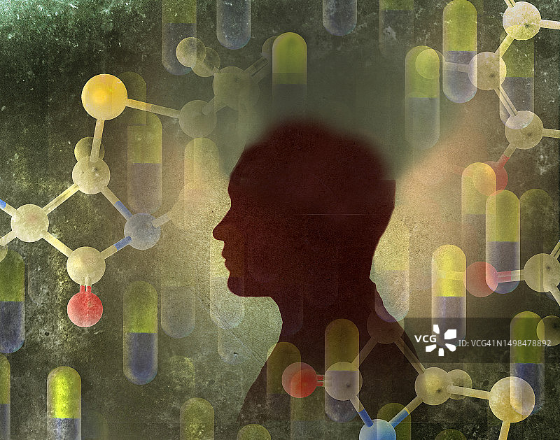 药丸和分子漂浮在男人剪影周围图片素材