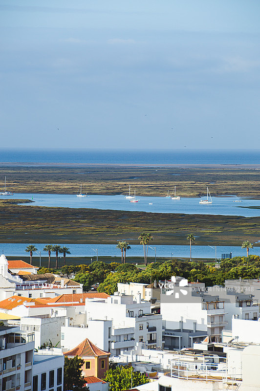 葡萄牙法鲁的日落海滨建筑景观图片素材